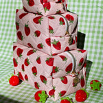 Load image into Gallery viewer, Stack of quilted bags with strawberry pattern on a green checkered background
