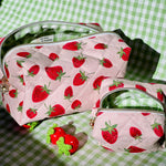Load image into Gallery viewer, Two cosmetic bags with strawberry pattern on a green checkered background
