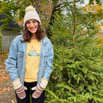 Load image into Gallery viewer, Person wearing a denim jacket and colorful sweatshirt in an outdoor setting.

