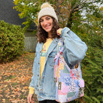 Load image into Gallery viewer, Person holding a patchwork bag outdoors with trees and leaves in the background
